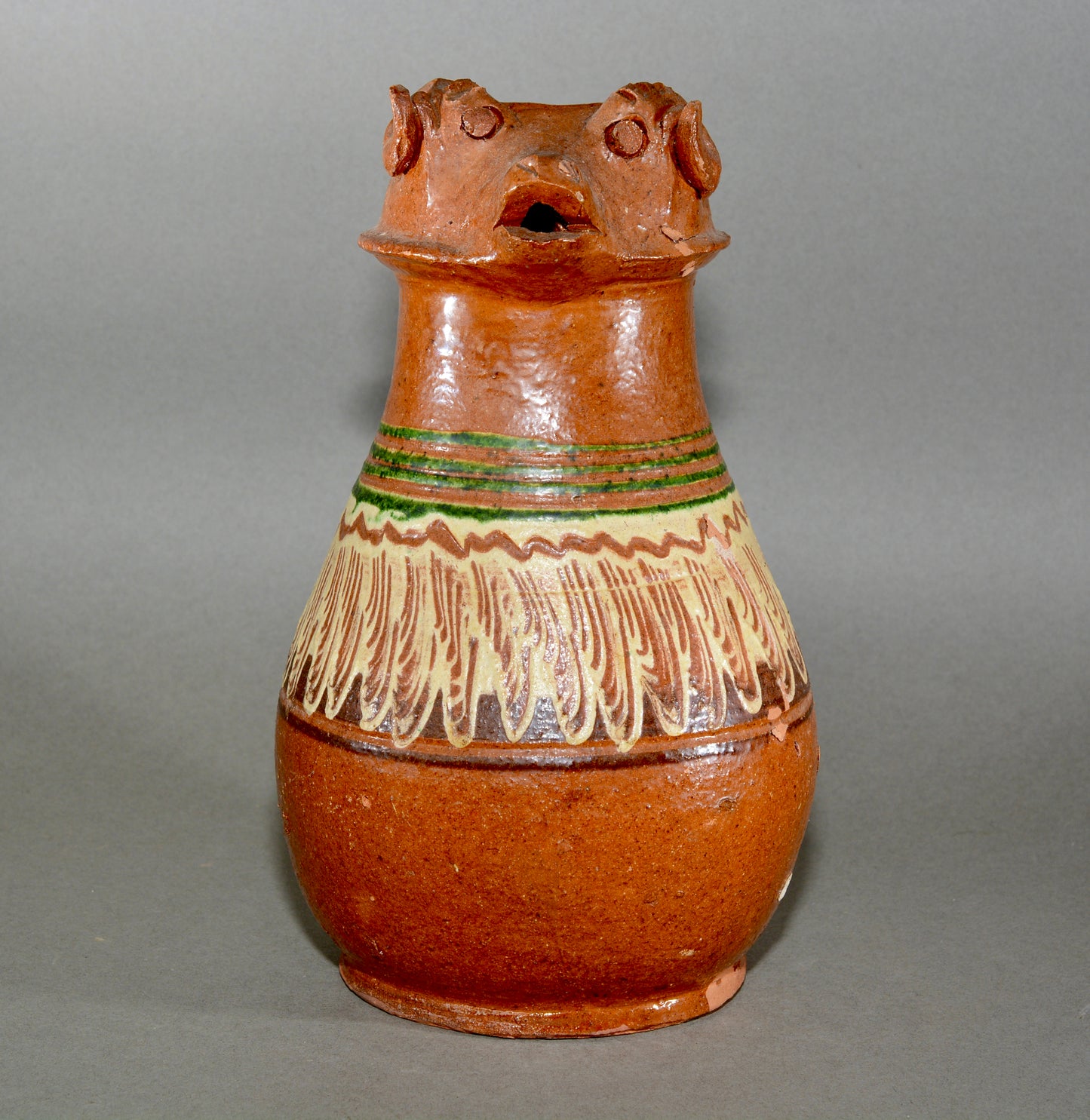 Vintage anthropomorphic slipware pottery jug
