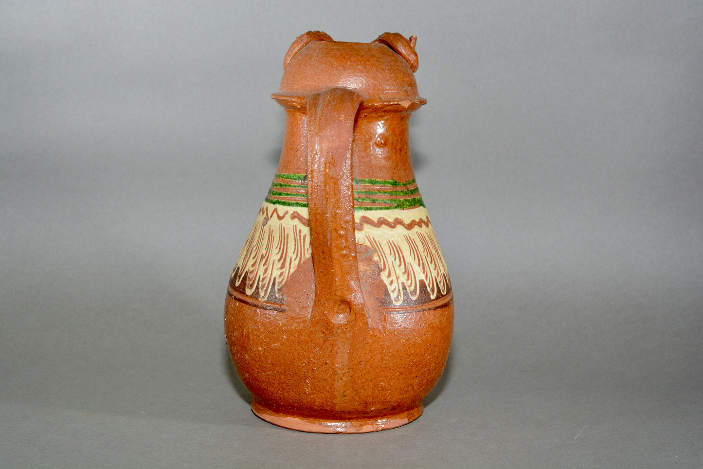 Vintage anthropomorphic slipware pottery jug