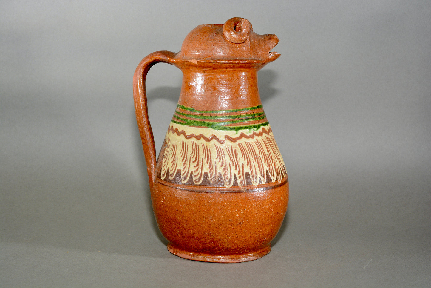 Vintage anthropomorphic slipware pottery jug