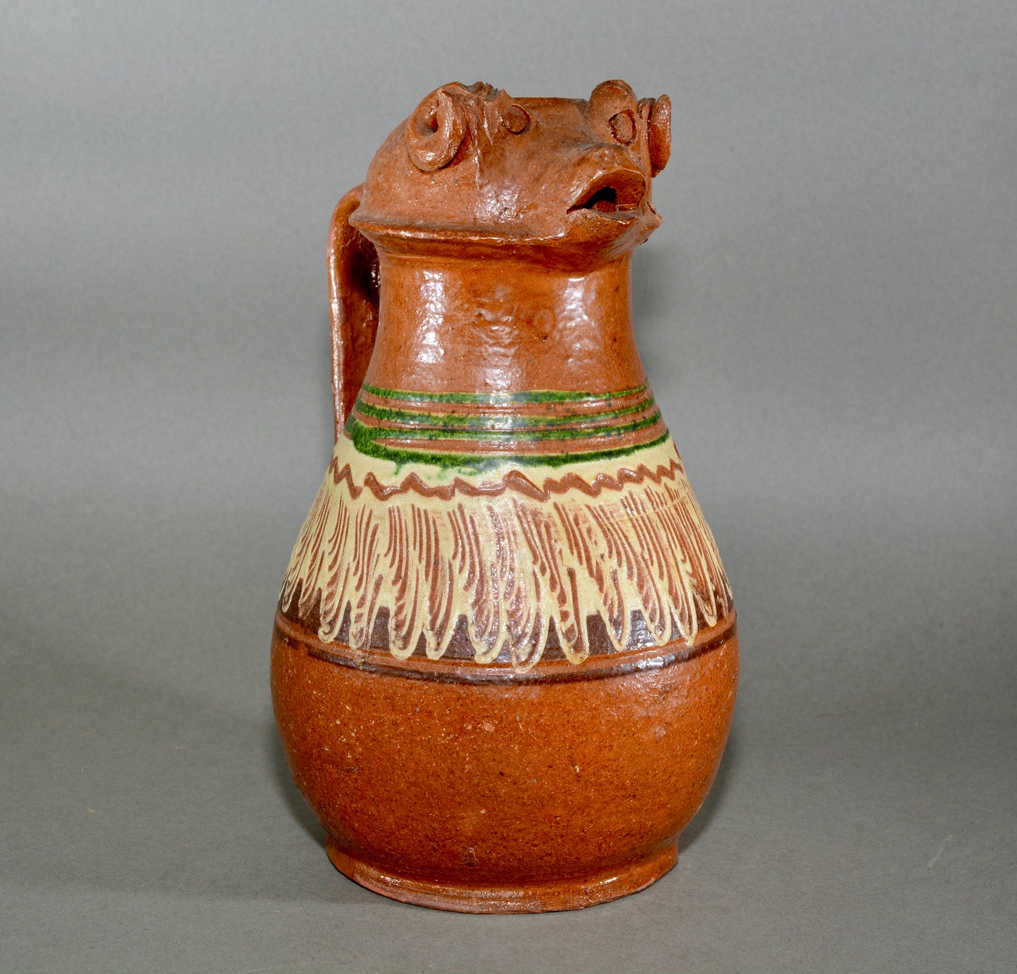 Vintage anthropomorphic slipware pottery jug