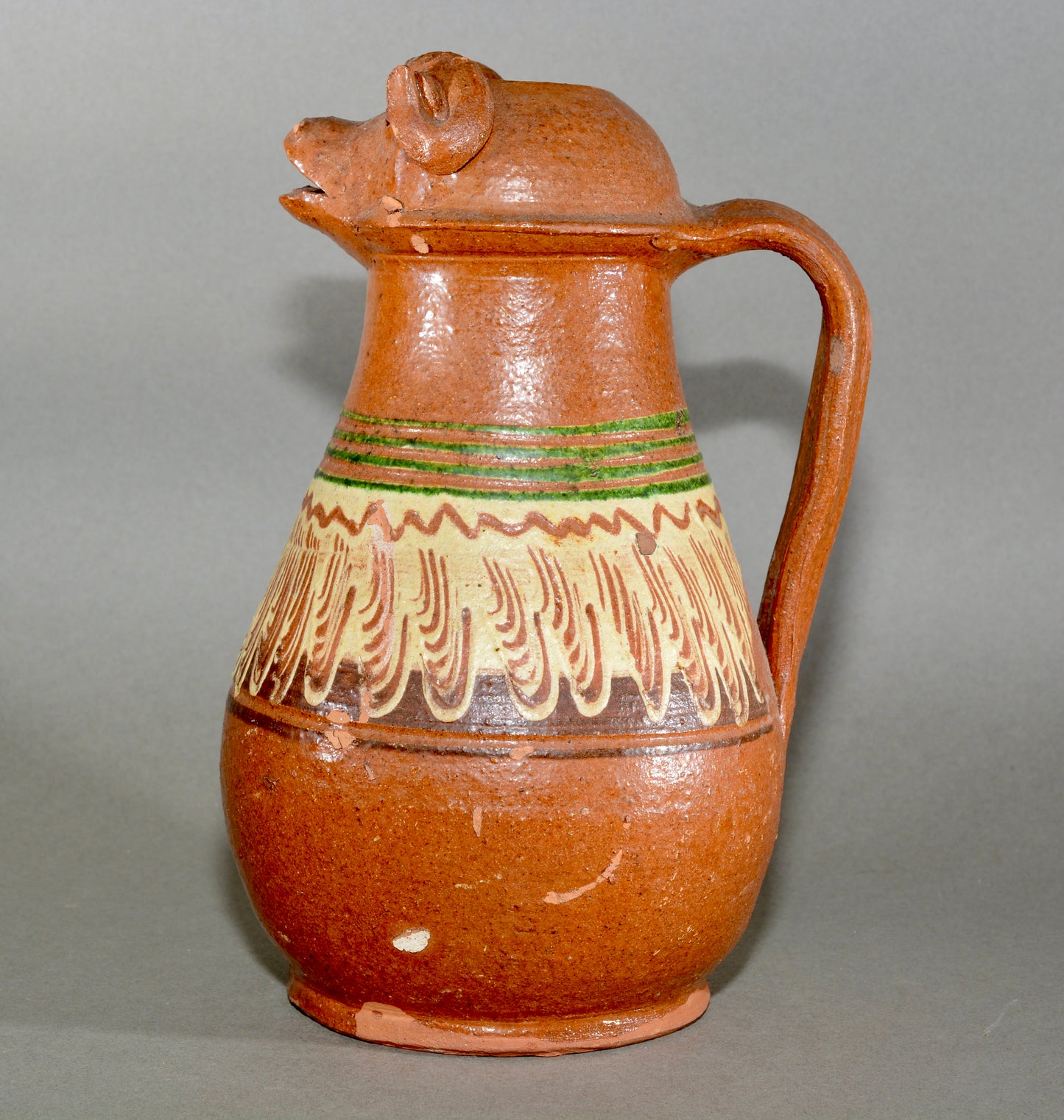 Vintage anthropomorphic slipware pottery jug