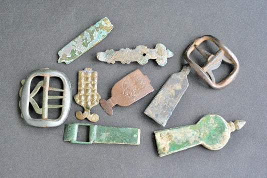 A collection of post medieval fittings buckle strap end