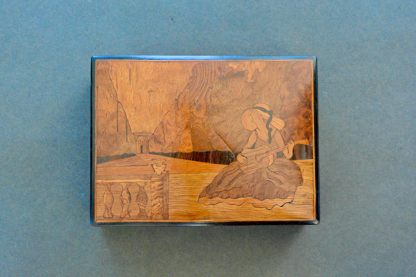 Art Deco inlaid maple box Lady playing guitar in a garden
