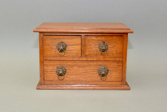 Edwardian oak miniature chest of drawers