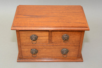 Edwardian oak miniature chest of drawers